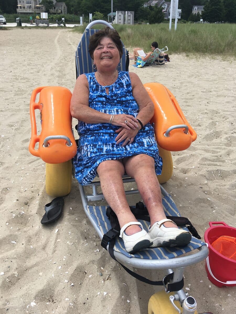 Senior enjoying an accessible beach outing on the Southcoast