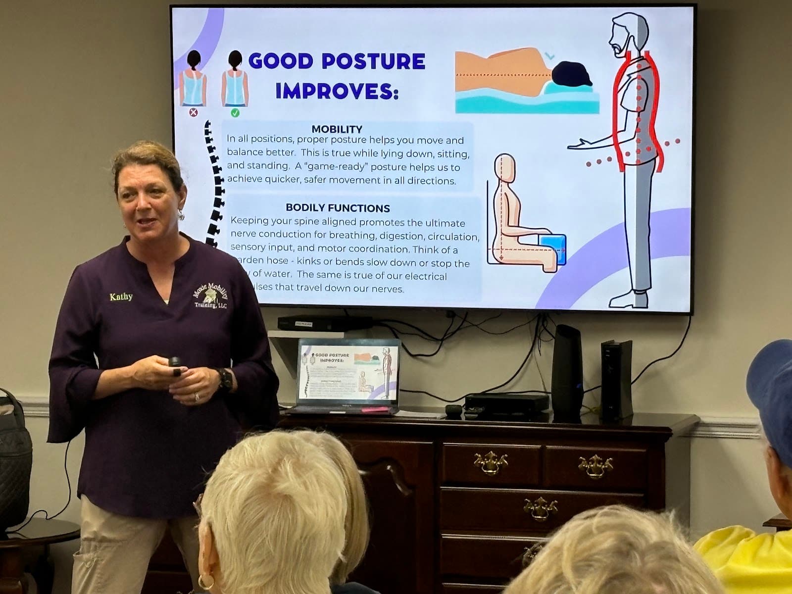 Kathy Clark teaching good posture techniques to a group of seniors at a community center